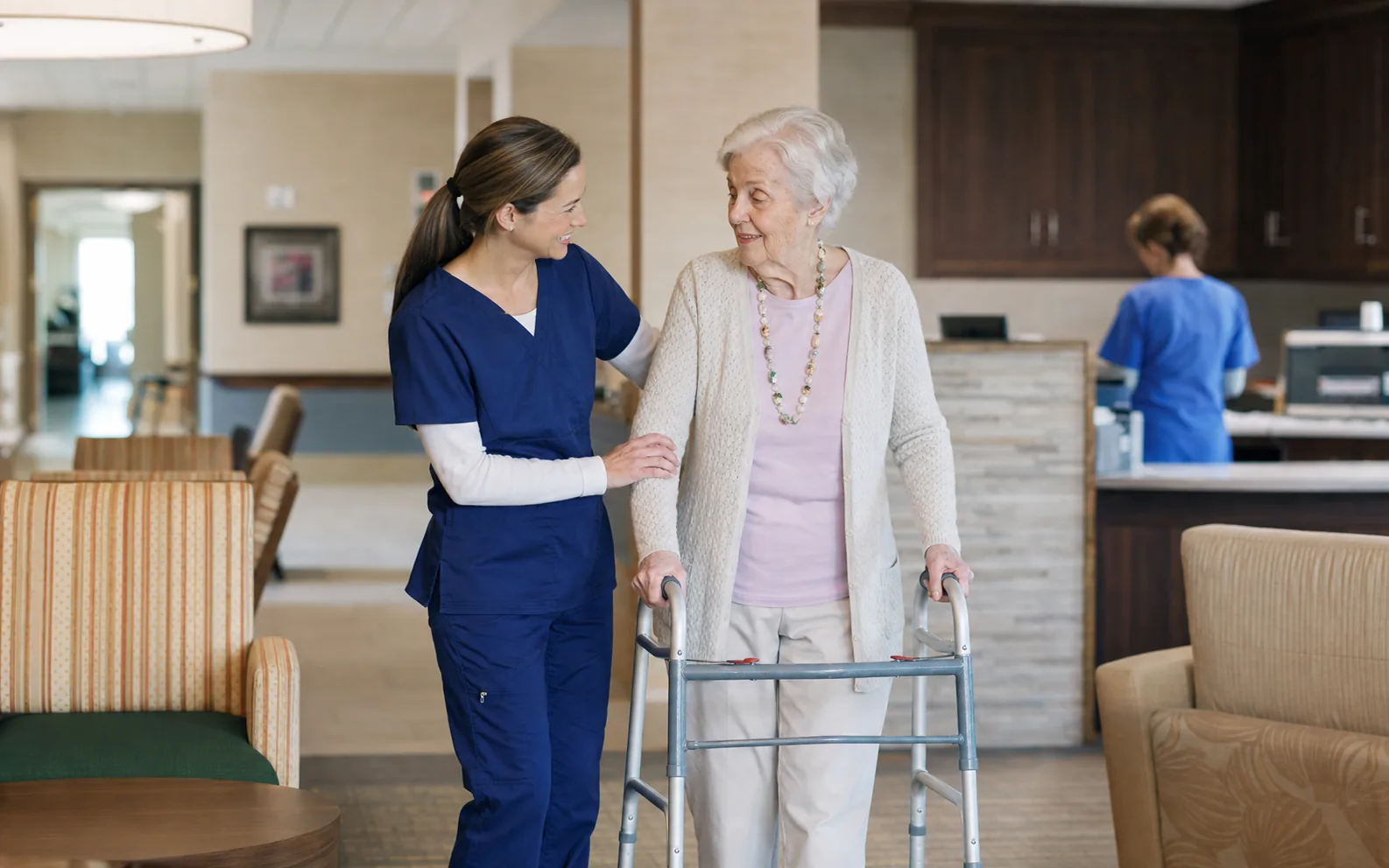 A caregiver supporting a resident in a skilled nursing facility.
